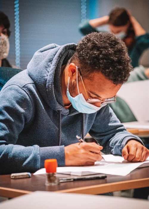 A student from G. Art working on the drawing